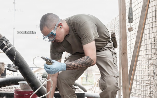 POL Airmen conduct fuel sampling and maintenance operations