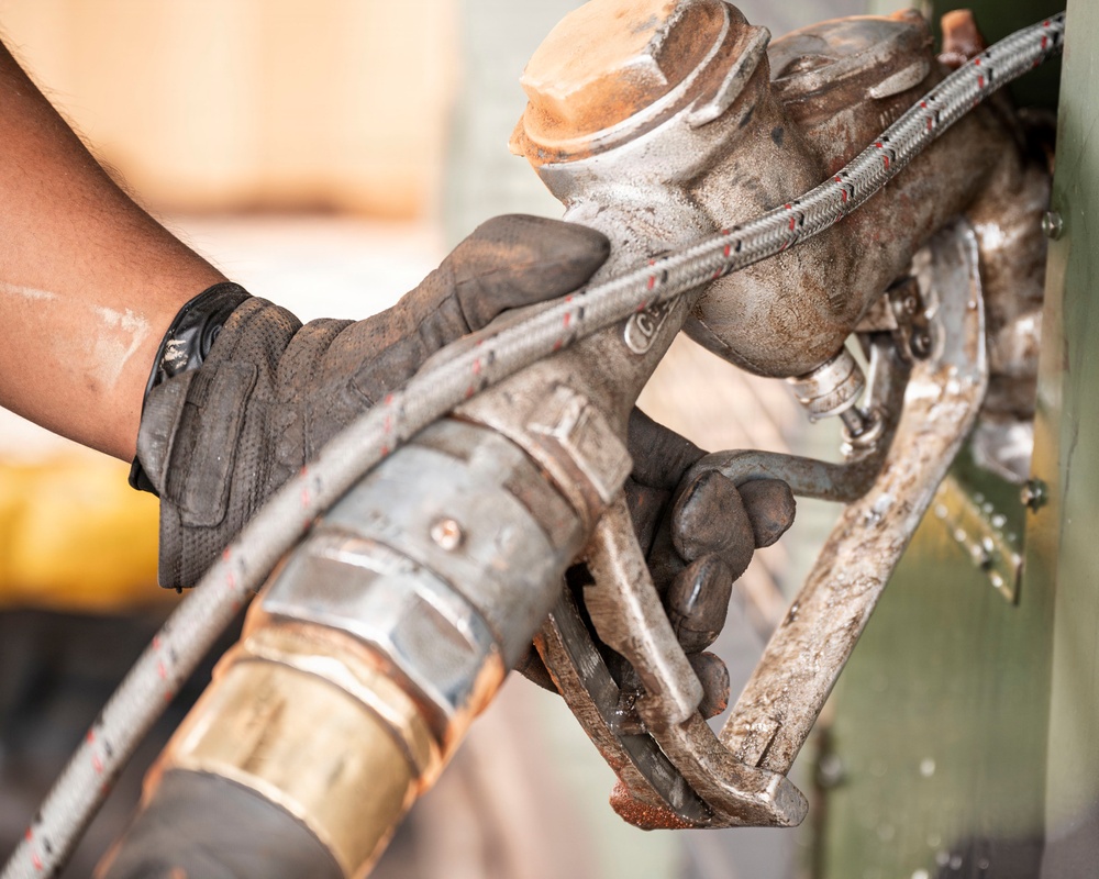 POL Airmen conduct fuel sampling and maintenance operations