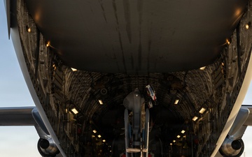 332nd ELRS unloads HH-60W from a C-17