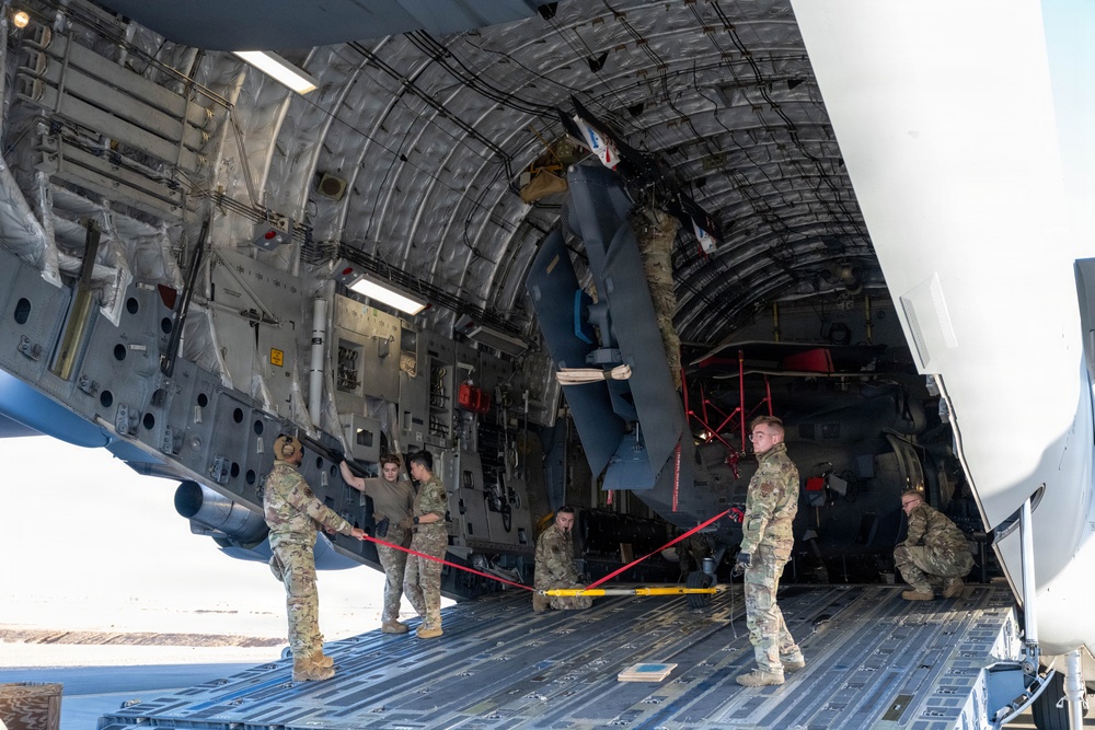 332nd ELRS unloads HH-60W from a C-17