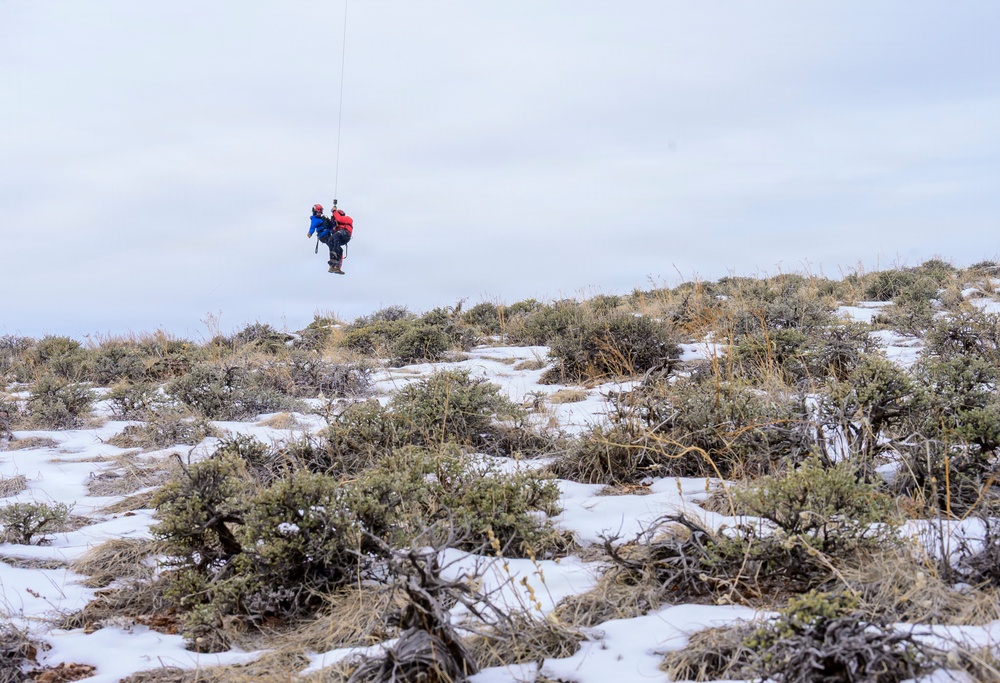 Wyoming Army Aviation teams and Big Horn County Serach and Rescue team perform hoist training