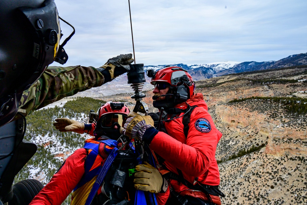 Wyoming Army Aviation teams and Big Horn County Serach and Rescue team perform hoist training