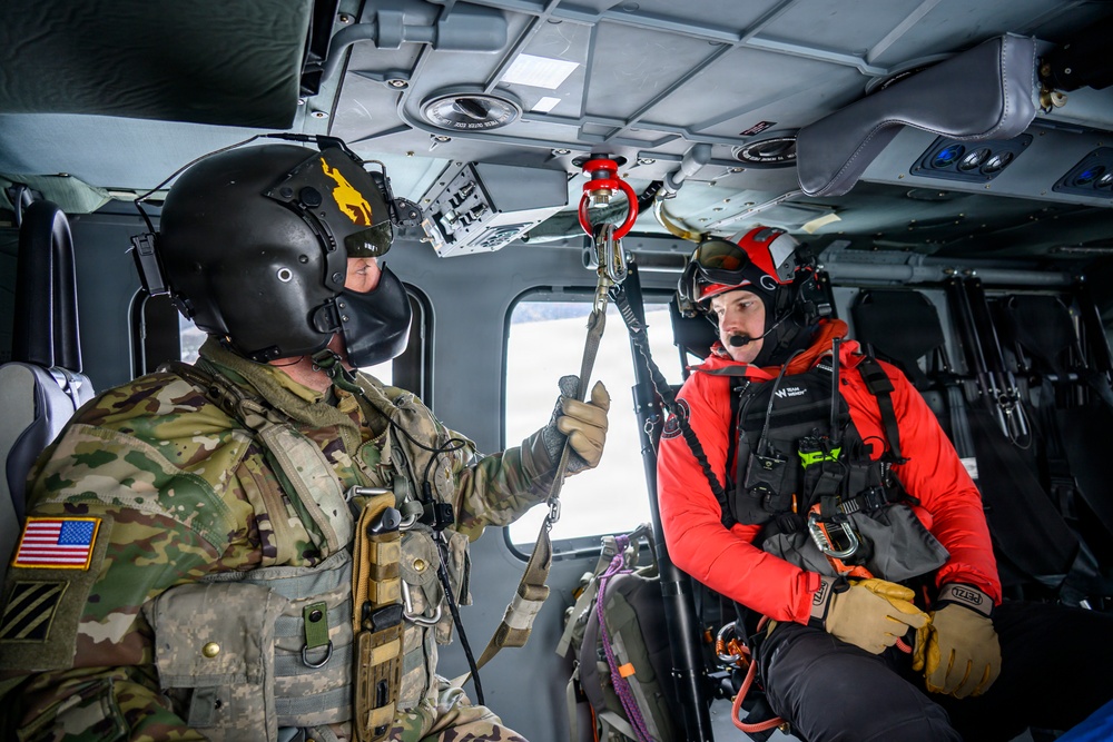 Wyoming Army Aviation teams and Big Horn County Serach and Rescue team perform hoist training