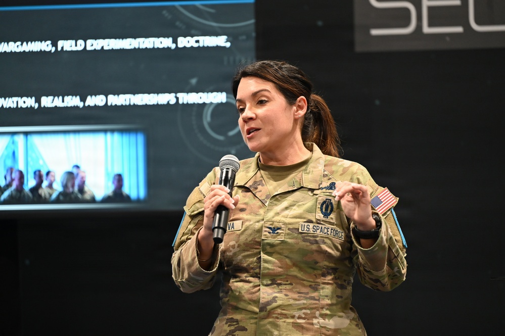 Col. Shannon DaSilva, Space Delta 10's commander, presents at the Space Mobility Conference