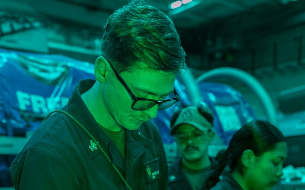 USS Tripoli Conducts A Low Light Gun Shoot