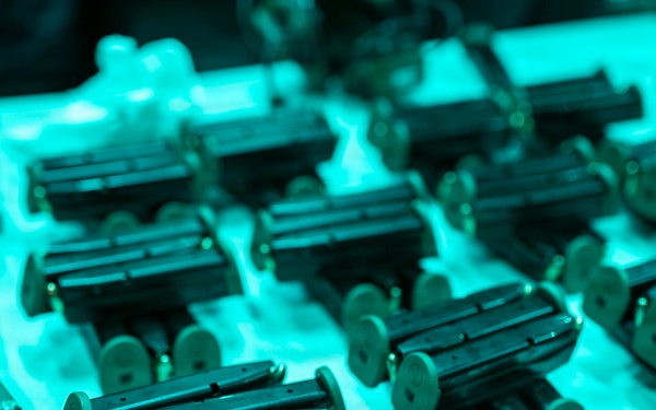 USS Tripoli Conducts A Low Light Gun Shoot