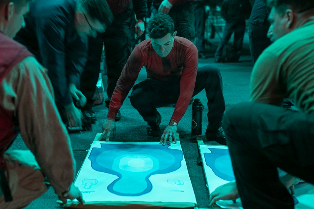 USS Tripoli Conducts A Low Light Gun Shoot