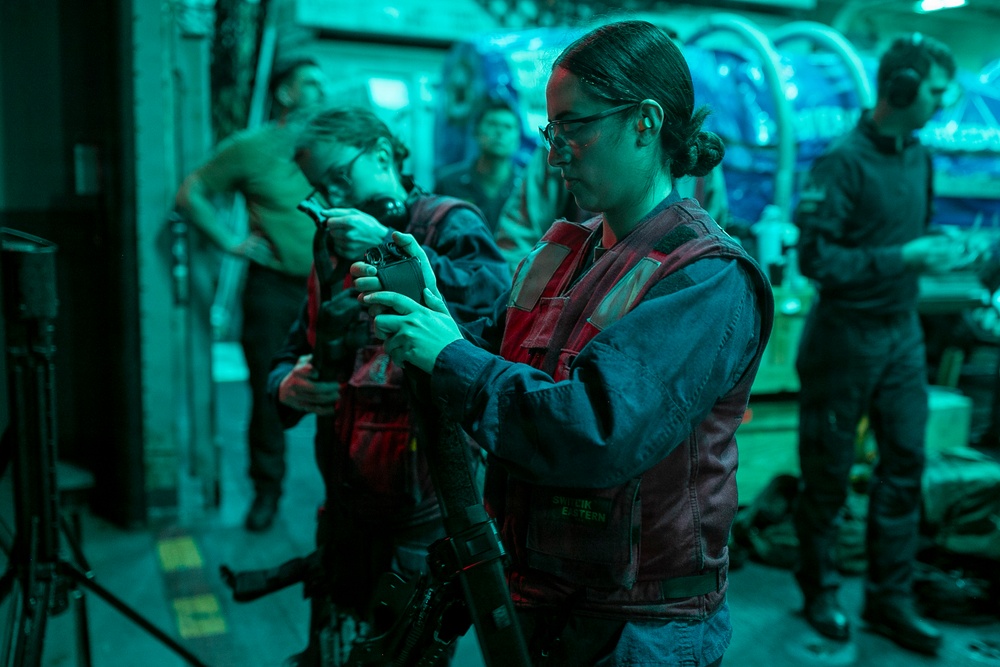 USS Tripoli Conducts A Low Light Gun Shoot
