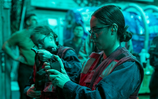 USS Tripoli Conducts A Low Light Gun Shoot