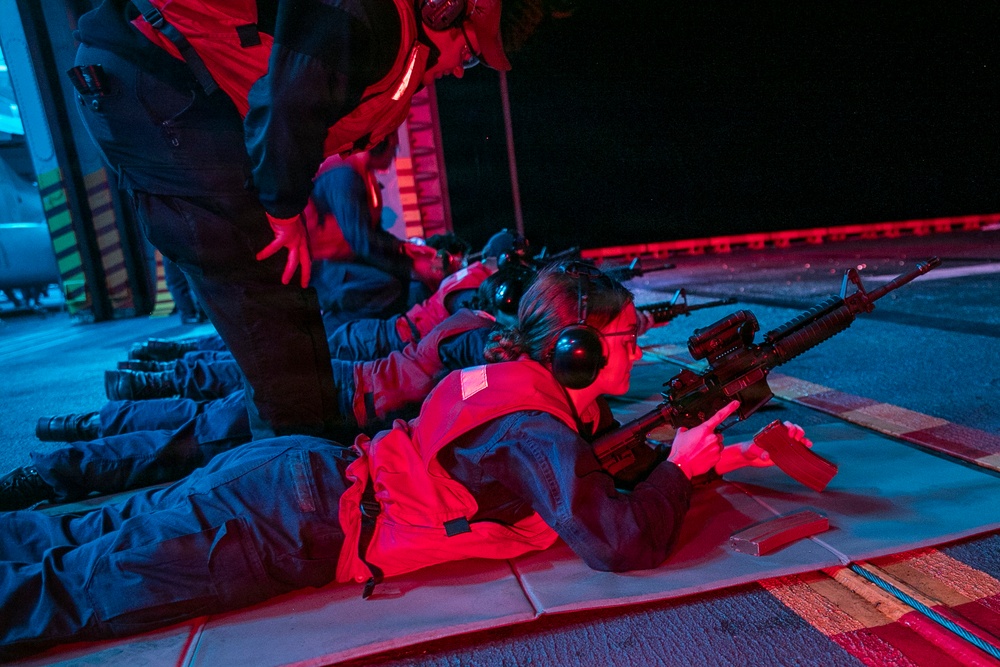 USS Tripoli Conducts A Low Light Gun Shoot