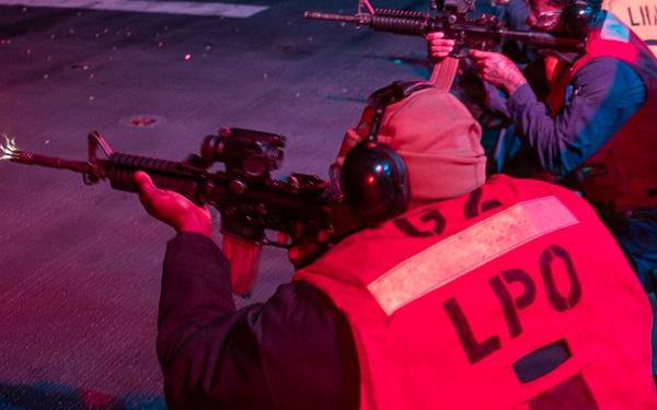 USS Tripoli Conducts A Low Light Gun Shoot