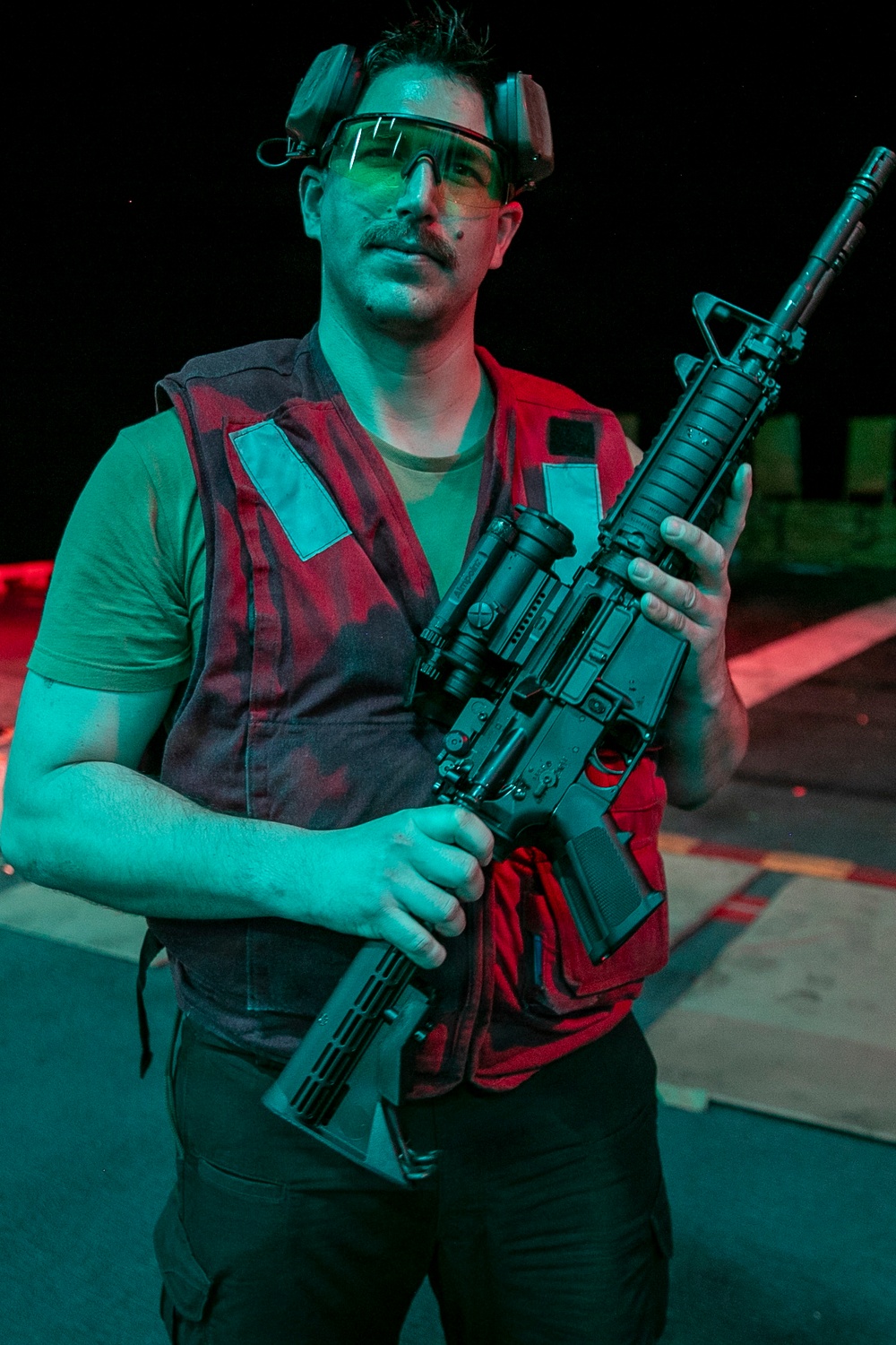USS Tripoli Conducts A Low Light Gun Shoot