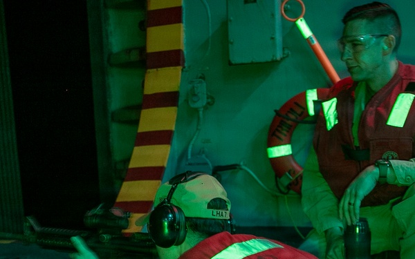 USS Tripoli Conducts A Low Light Gun Shoot