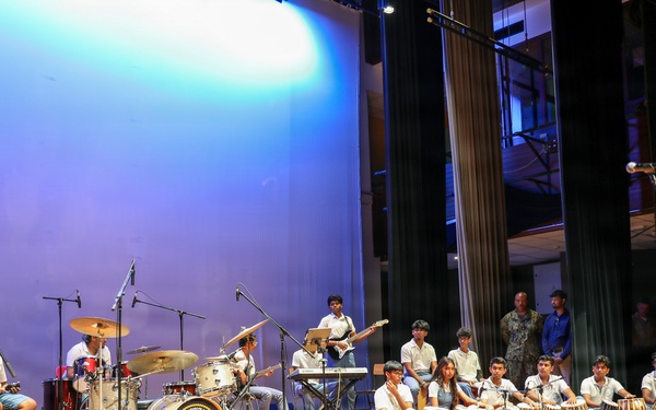 U.S. Naval Forces Europe and Africa Band (Topside Brass Band) perform for Students from the Mahatma Gandhi Institute Secondary School (MGISS)