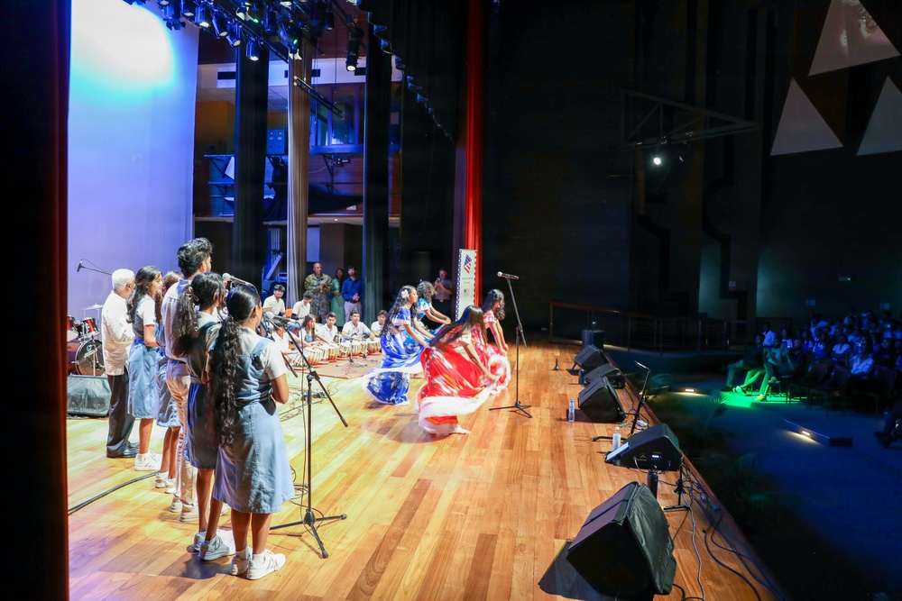 U.S. Naval Forces Europe and Africa Band (Topside Brass Band) perform for students and staff of the Mahatma Gandhi Institute Secondary School (MGISS)