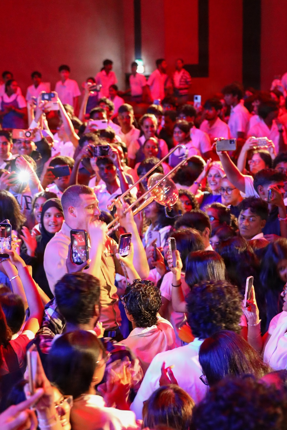 U.S. Naval Forces Europe and Africa Band (Topside Brass Band) play a concert for students and staff of the Mahatma Gandhi Institute Secondary School (MGISS)