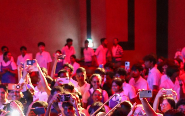 U.S. Naval Forces Europe and Africa Band (Topside Brass Band) play a concert for students and staff of the Mahatma Gandhi Institute Secondary School (MGISS)