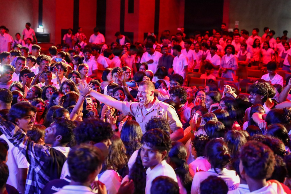 U.S. Naval Forces Europe and Africa Band (Topside Brass Band) play a concert for students and staff of the Mahatma Gandhi Institute Secondary School (MGISS)