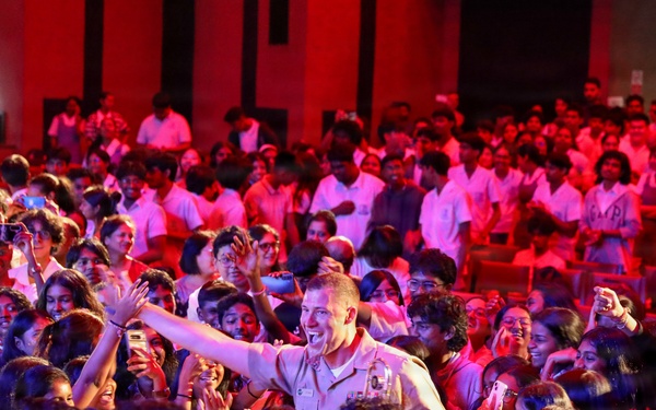 U.S. Naval Forces Europe and Africa Band (Topside Brass Band) play a concert for students and staff of the Mahatma Gandhi Institute Secondary School (MGISS)