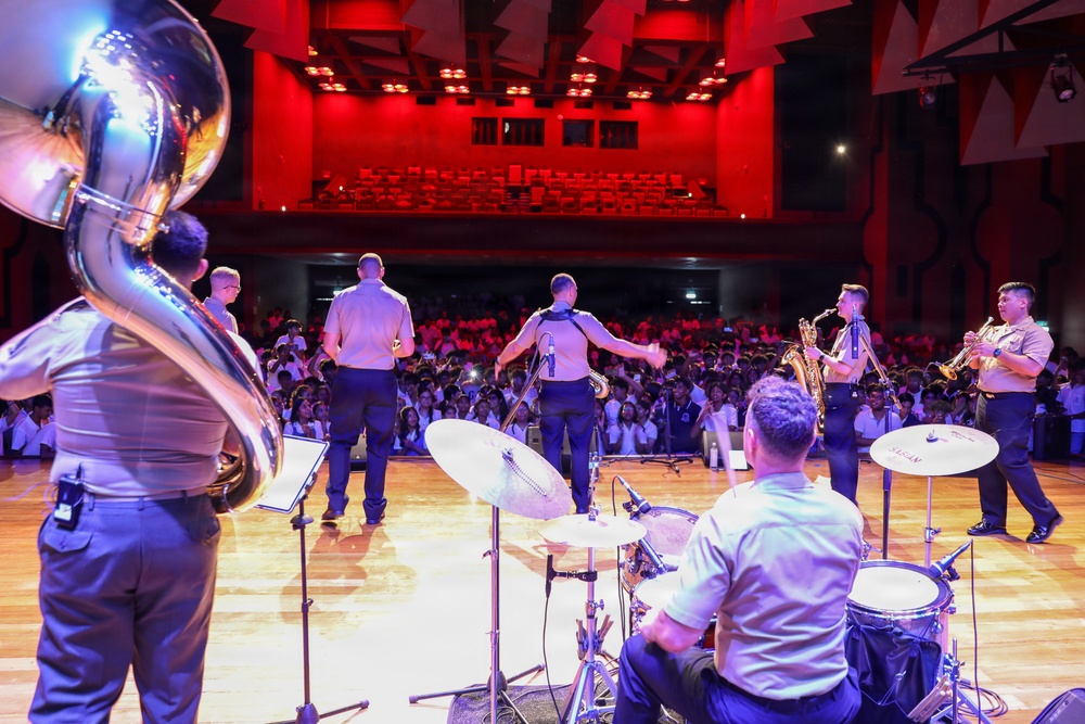 U.S. Naval Forces Europe and Africa Band (Topside Brass Band) play a concert for students and staff of the Mahatma Gandhi Institute Secondary School (MGISS)