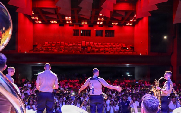 U.S. Naval Forces Europe and Africa Band (Topside Brass Band) play a concert for students and staff of the Mahatma Gandhi Institute Secondary School (MGISS)