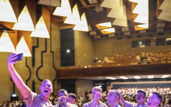 U.S. Naval Forces Europe and Africa Band (Topside Brass Band) play a concert for students and staff of the Mahatma Gandhi Institute Secondary School (MGISS)