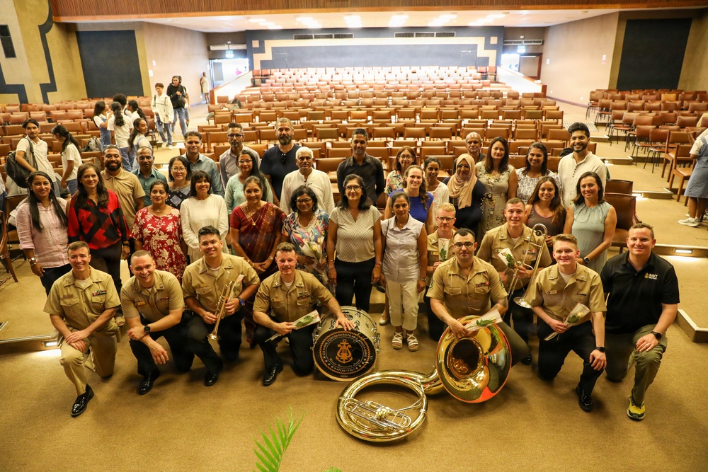 U.S. Naval Forces Europe and Africa Band (Topside Brass Band) play a concert for students and staff of the Mahatma Gandhi Institute Secondary School (MGISS)