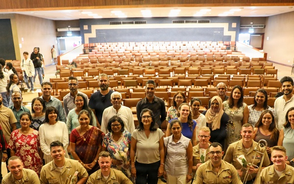 U.S. Naval Forces Europe and Africa Band (Topside Brass Band) play a concert for students and staff of the Mahatma Gandhi Institute Secondary School (MGISS)