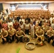 U.S. Naval Forces Europe and Africa Band (Topside Brass Band) play a concert for students and staff of the Mahatma Gandhi Institute Secondary School (MGISS)