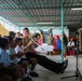Members of the U.S. Naval Forces Europe and Africa Band (Topside Brass Band) perform for students and teachers at Vent d'un Rêve