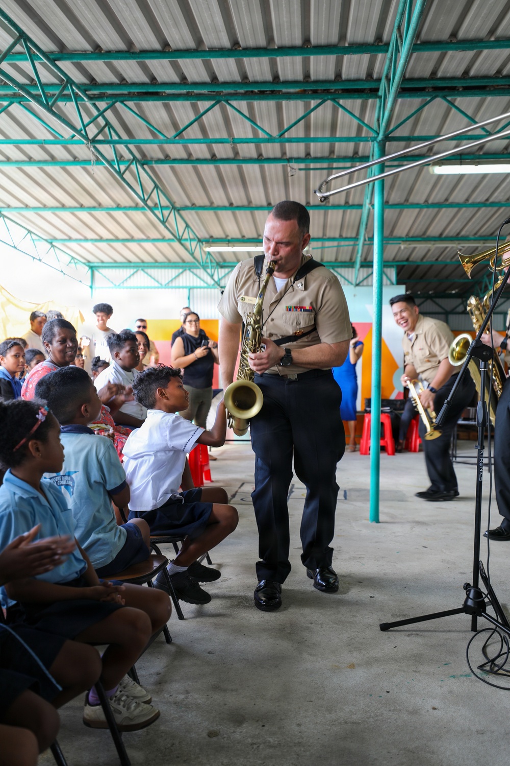 U.S. Naval Forces Europe and Africa Band (Topside Brass Band) perform for students and teachers at Vent d'un Rêve