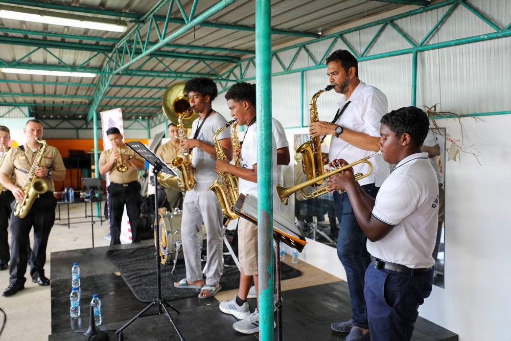 U.S. Naval Forces Europe and Africa Band (Topside Brass Band) perform for students and teachers at Vent d'un Rêve