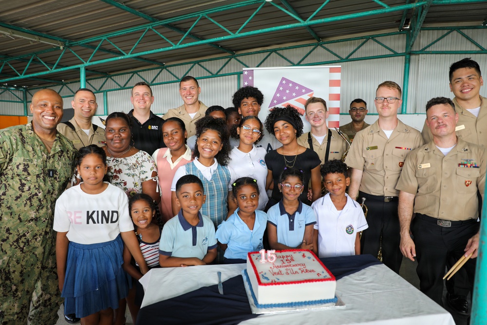 U.S. Naval Forces Europe and Africa Band (Topside Brass Band) perform for students and teachers at Vent d'un Rêve