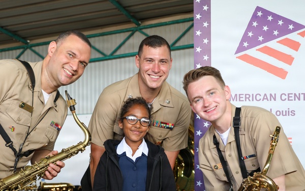 U.S. Naval Forces Europe and Africa Band (Topside Brass Band) perform for students and teachers at Vent d'un Rêve