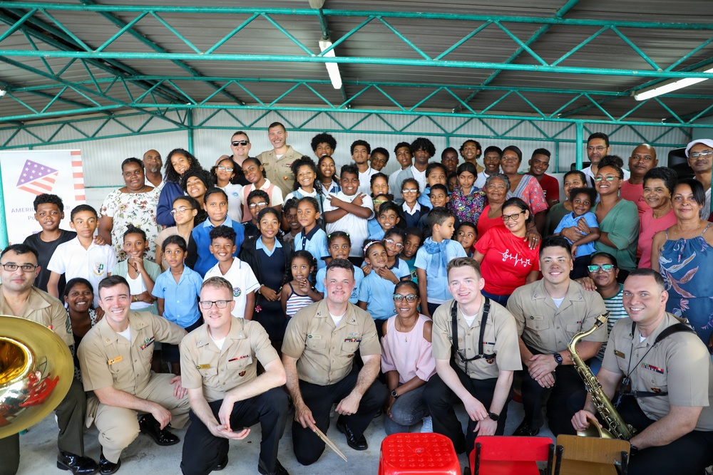 U.S. Naval Forces Europe and Africa Band (Topside Brass Band) perform for students and teachers at Vent d'un Rêve
