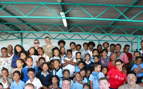 U.S. Naval Forces Europe and Africa Band (Topside Brass Band) perform for students and teachers at Vent d'un Rêve