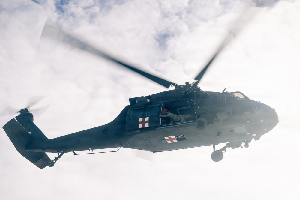 U.S. service members practice joint-service casualty evacuation drills during Mountain Medicine Course 1-26