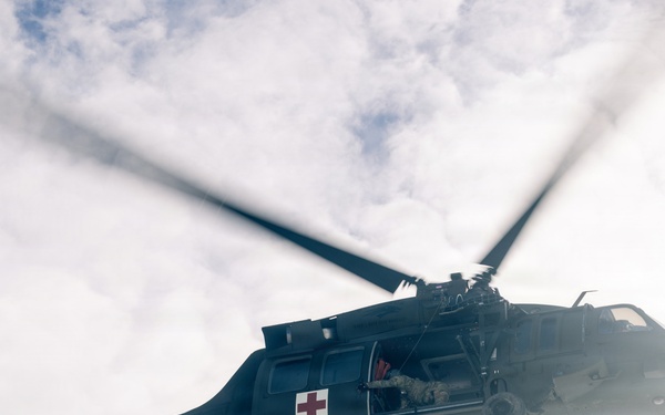 U.S. service members practice joint-service casualty evacuation drills during Mountain Medicine Course 1-26