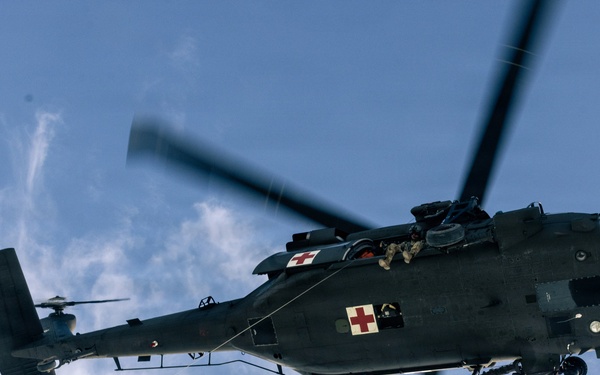 U.S. service members practice joint-service casualty evacuation drills during Mountain Medicine Course 1-26
