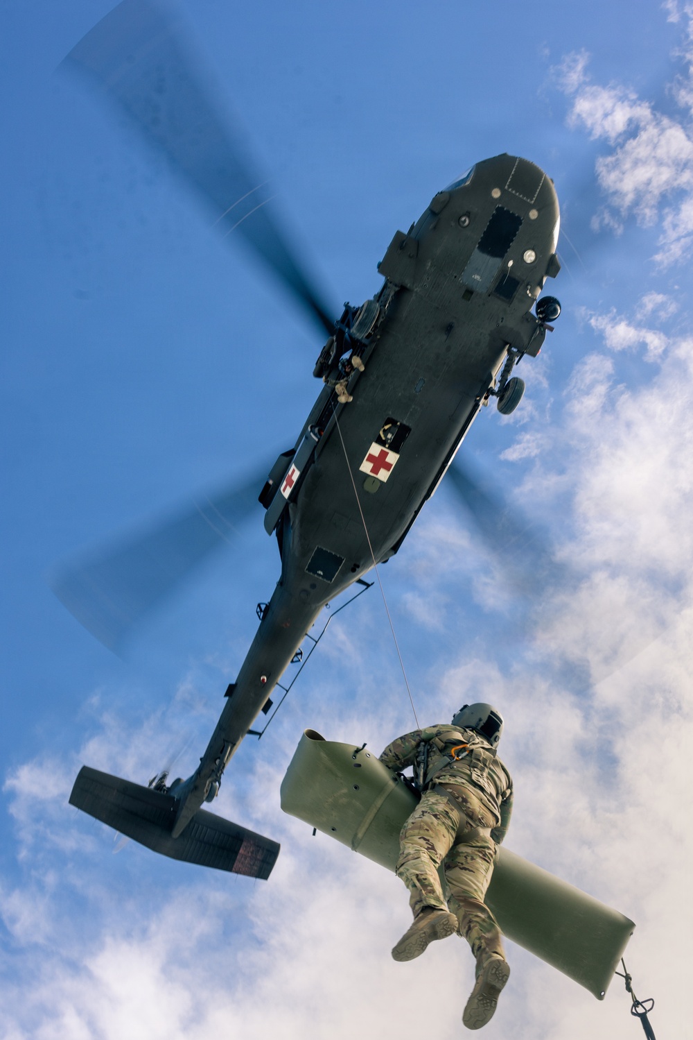 U.S. service members practice joint-service casualty evacuation drills during Mountain Medicine Course 1-26
