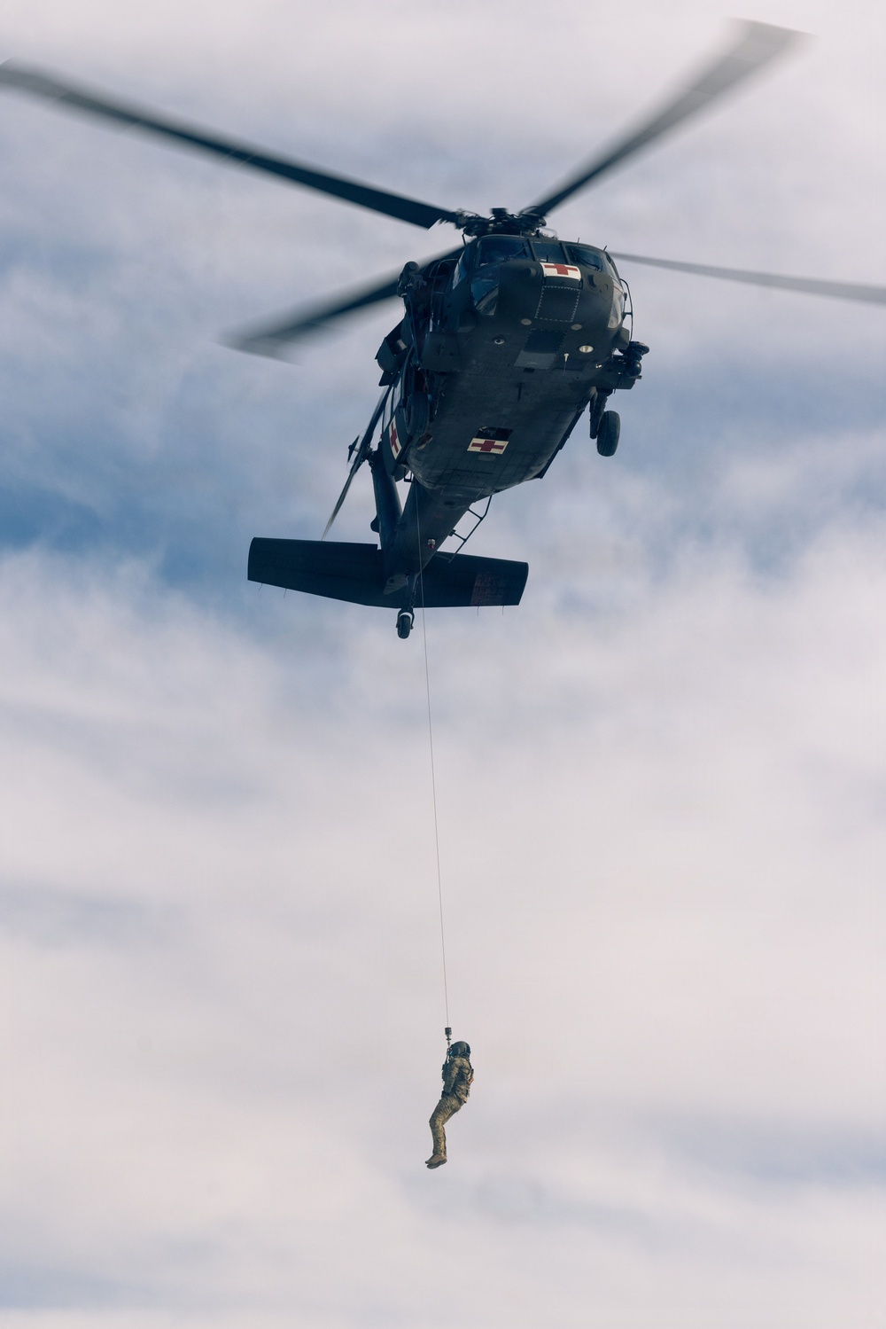 U.S. service members practice joint-service casualty evacuation drills during Mountain Medicine Course 1-26