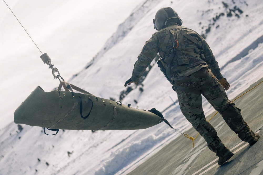 U.S. service members practice joint-service casualty evacuation drills during Mountain Medicine Course 1-26