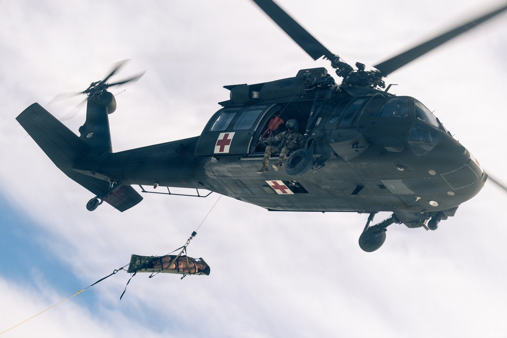 U.S. service members practice joint-service casualty evacuation drills during Mountain Medicine Course 1-26