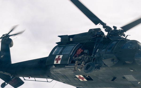 U.S. service members practice joint-service casualty evacuation drills during Mountain Medicine Course 1-26