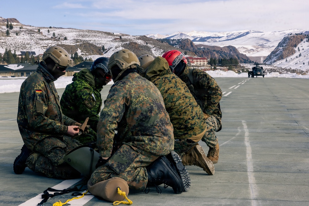 U.S. service members practice joint-service casualty evacuation drills during Mountain Medicine Course 1-26
