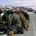U.S. service members practice joint-service casualty evacuation drills during Mountain Medicine Course 1-26