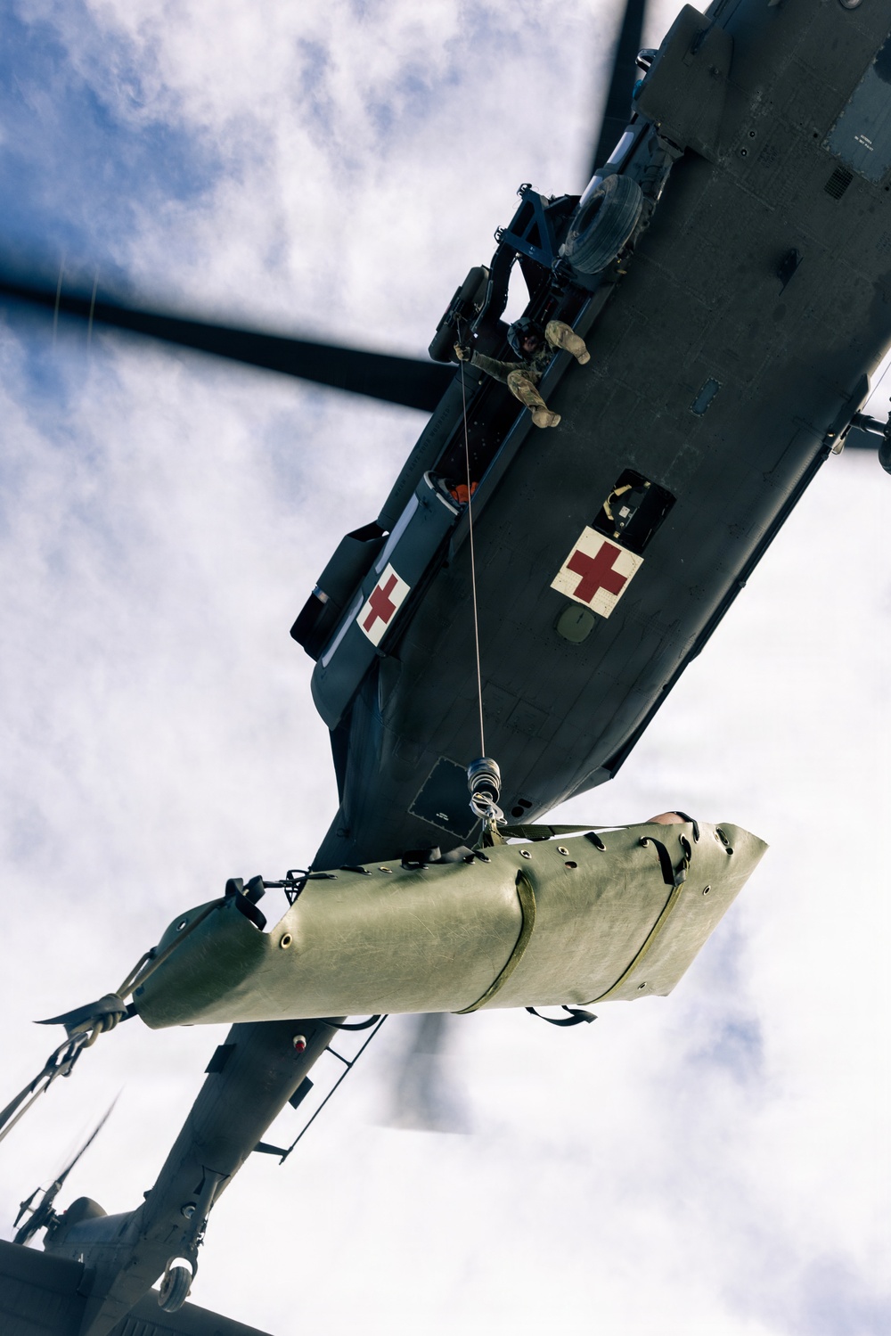 U.S. service members practice joint-service casualty evacuation drills during Mountain Medicine Course 1-26