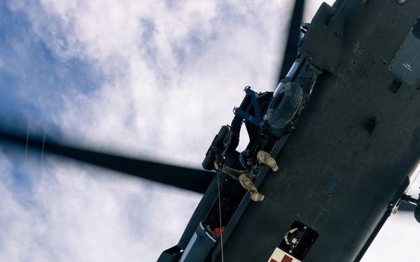 U.S. service members practice joint-service casualty evacuation drills during Mountain Medicine Course 1-26