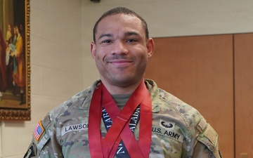 Army Sgt. Zephaniah Lawson poses with competition awards