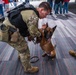 U.S. Coast Guard Maritime Safety and Security Team conduct K-9 sweeps in preparation for the Super Bowl.